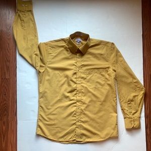 A yellow button downed shirt